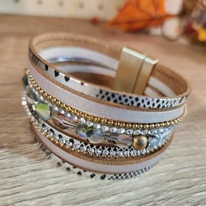 Beautiful cuff bracelet with vinyl detail and AB beading.